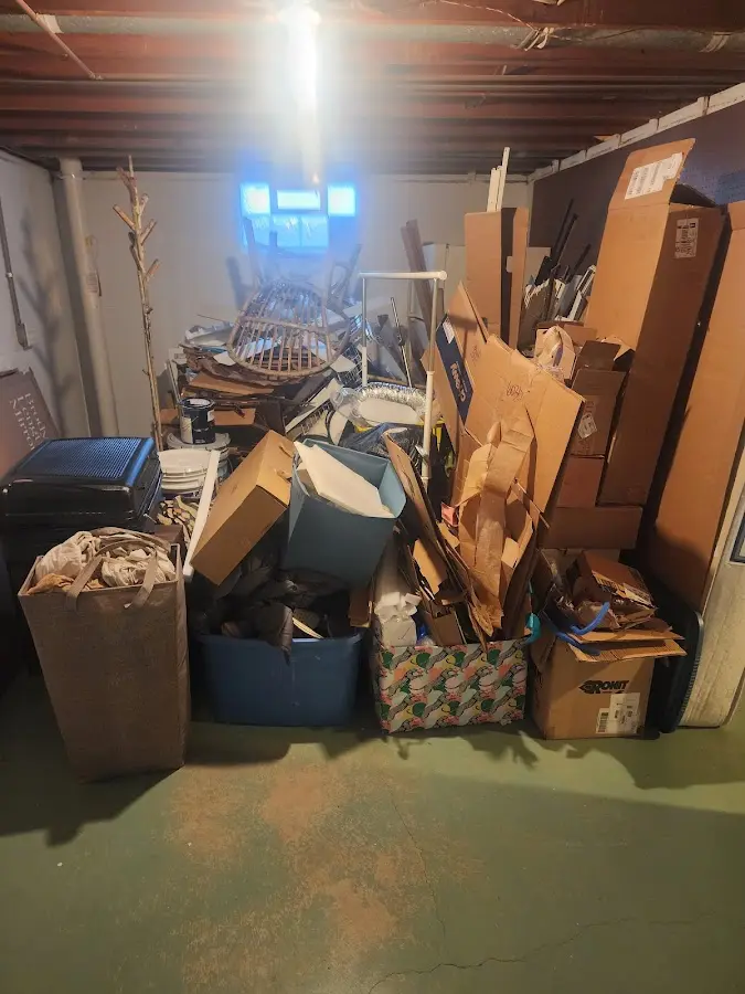 Roll-off dumpster container at job site for 15 Yard Dumpster Rental in Dennis